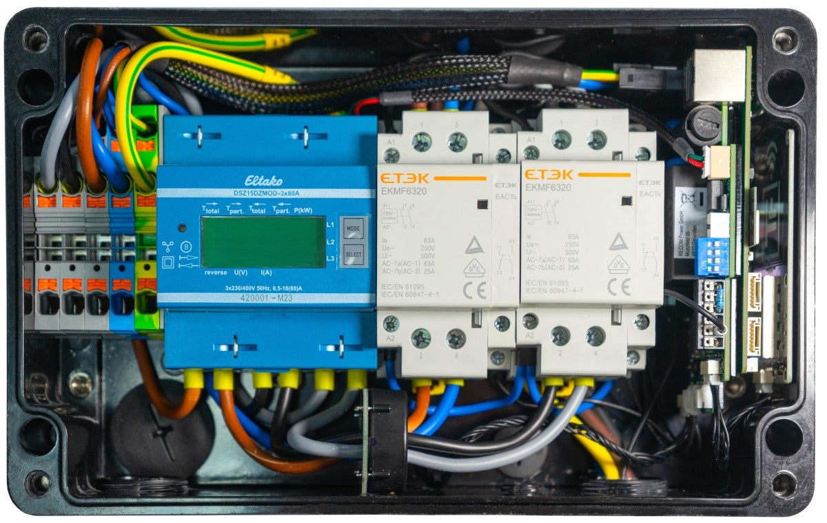 WARP Charger PRO interior showing the electronics, switches and energy meter